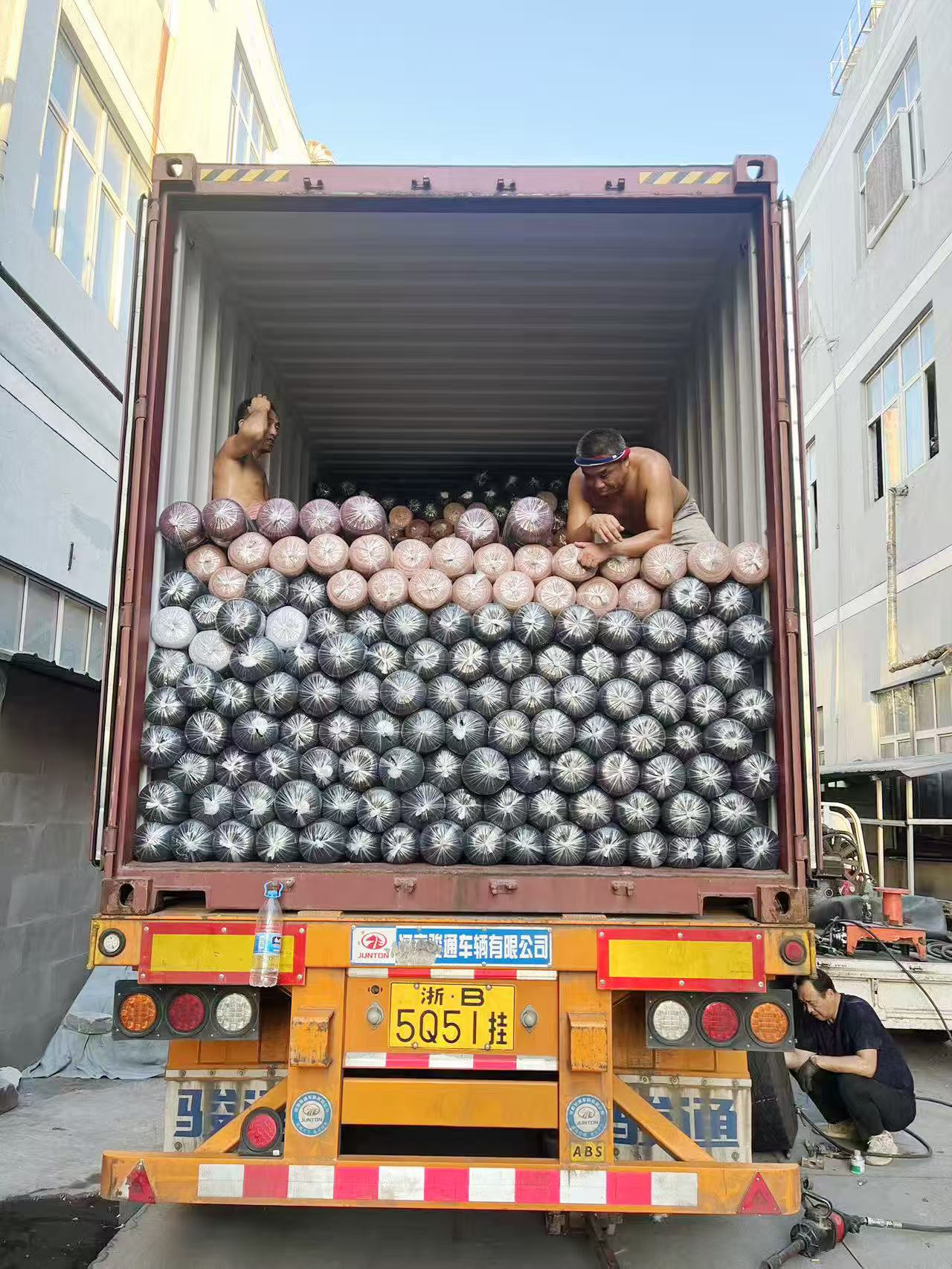 Worker packaging fabric rolls